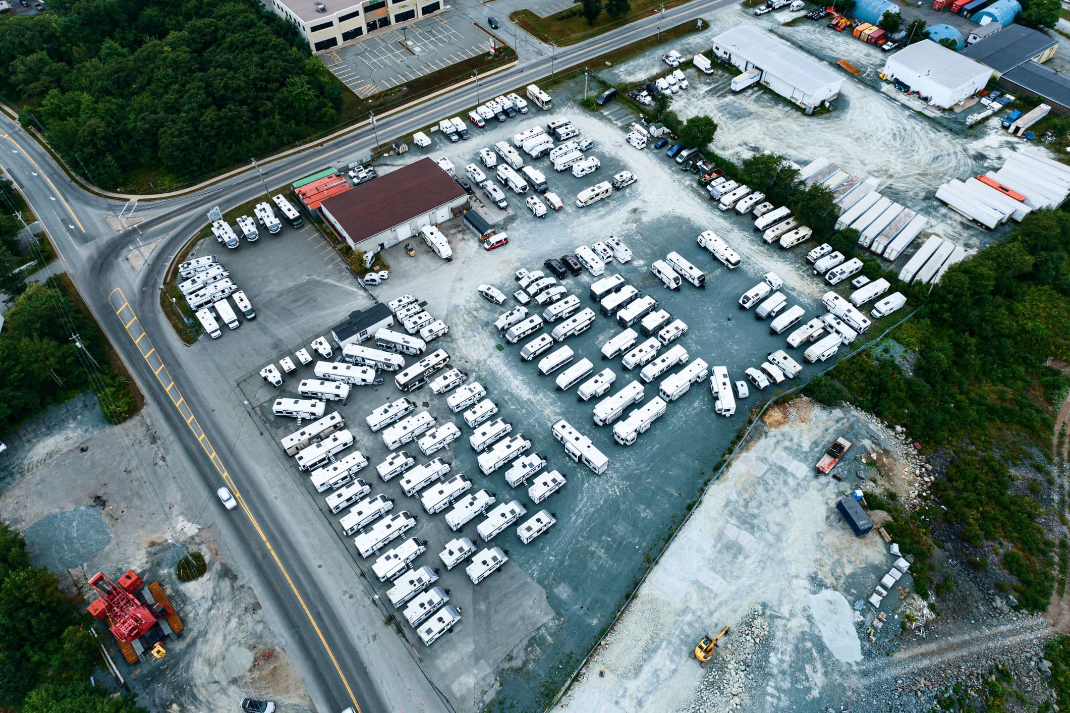 RVs in secure West Palm Beach facility with palm trees and covered parking
